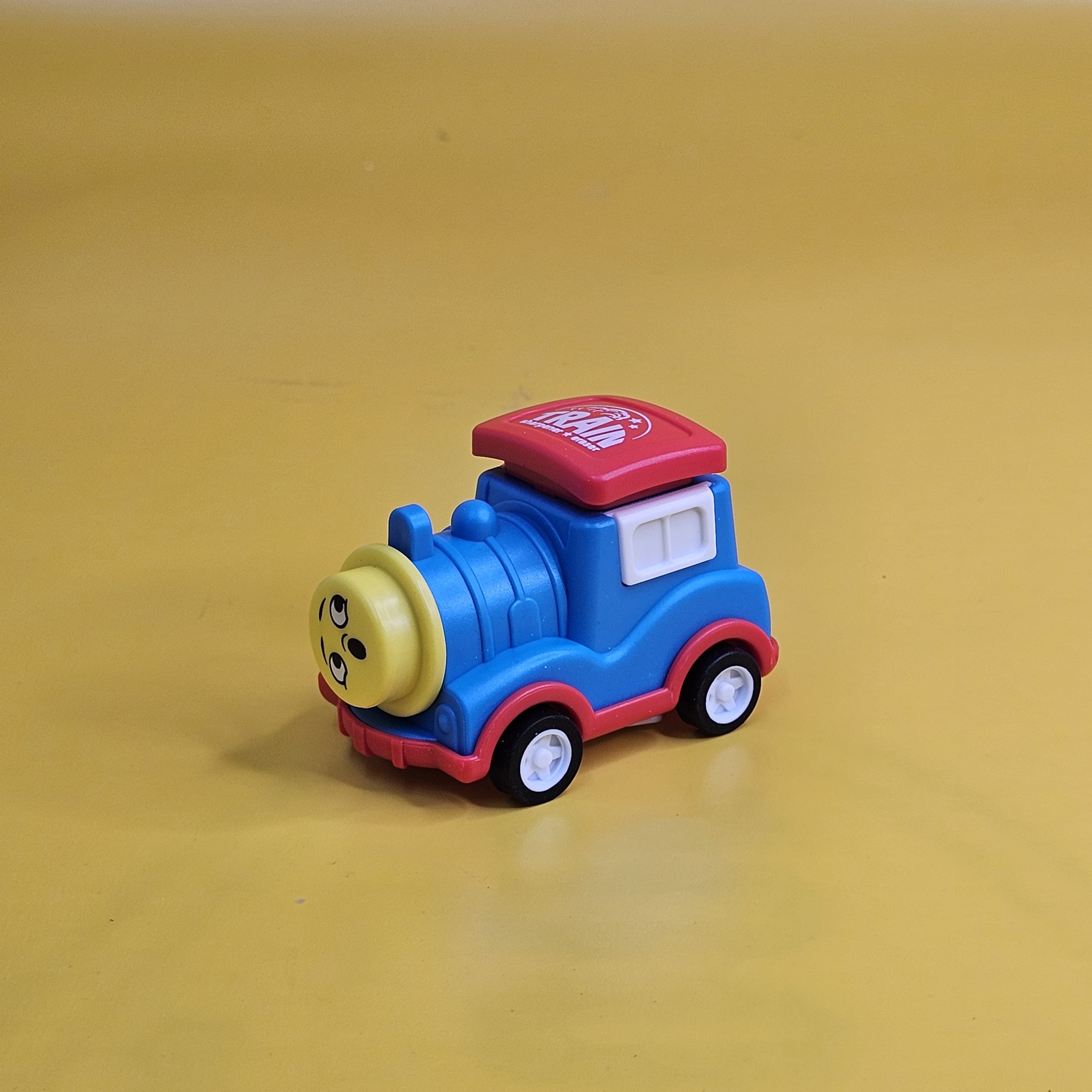Set of four multicolour train-shaped pencil sharpeners with built-in erasers for kids' stationery www.usmile.toys